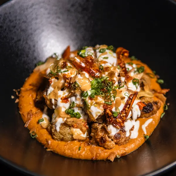 Charred cauliflower in Almond Romesco